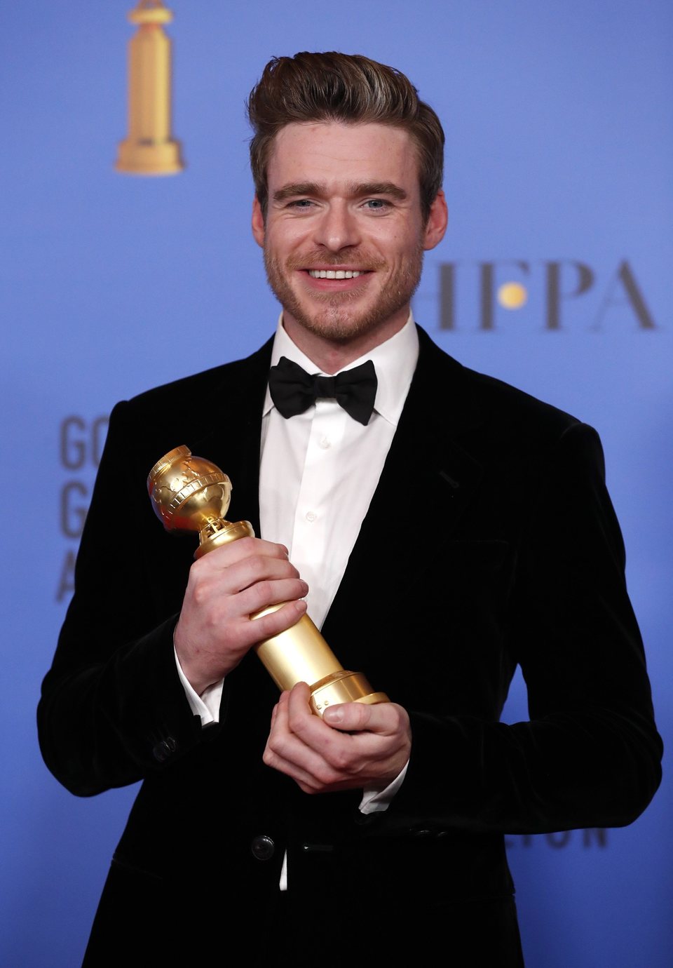 Richard Madden poses with his Golden Globe