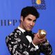 Darren Criss poses with his Golden Globe