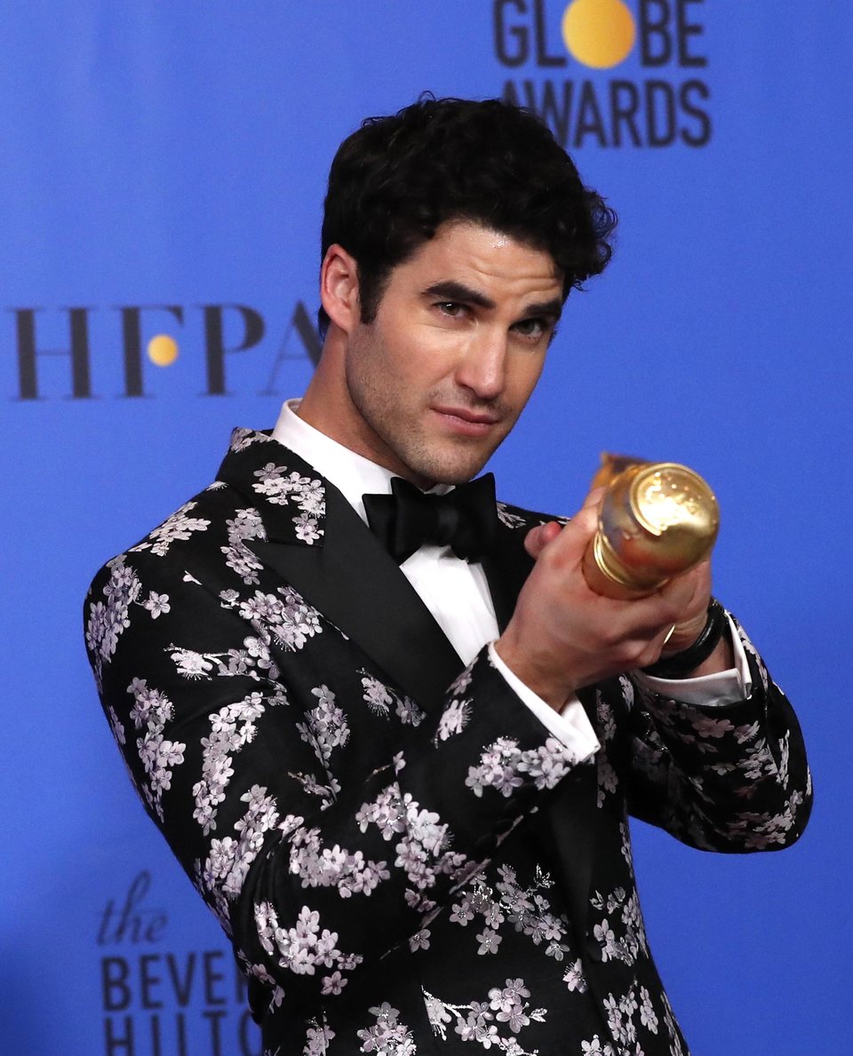 Darren Criss poses with his Golden Globe