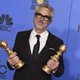 Alfonso Cuarón poses with two Golden Globes