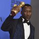 Mahershala Ali poses with his Golden Globe