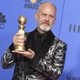 Ryan Murphy poses with a Golden Globe