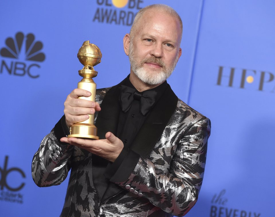 Ryan Murphy poses with a Golden Globe