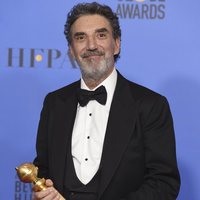 Chuck Lorre poses with the Golden Globe for Best Television Series, musical or comedy 