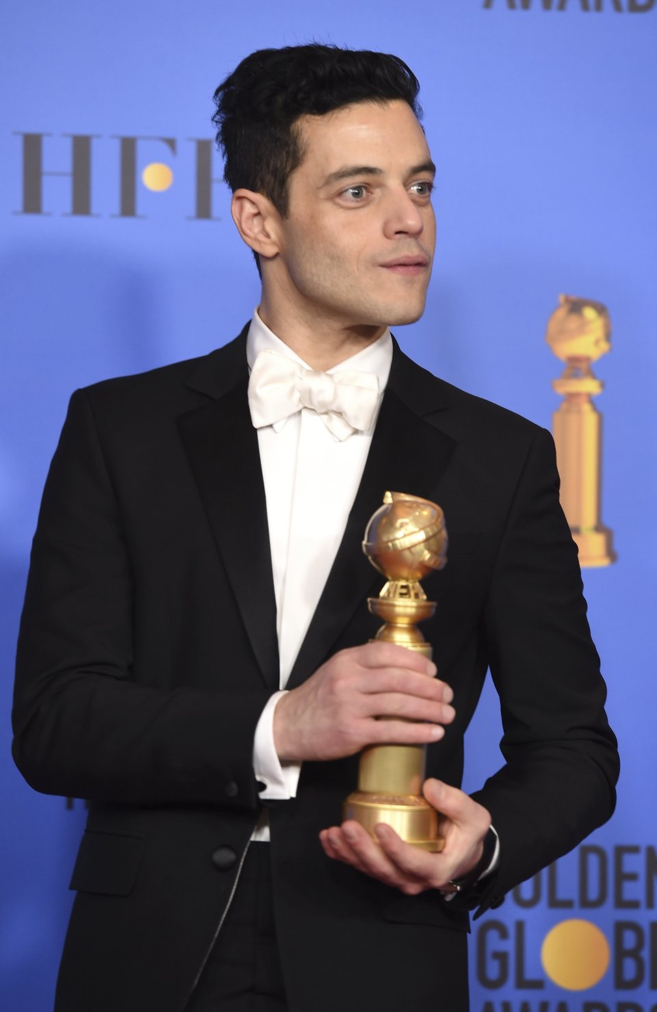 Rami Malek poses with his Golden Globe