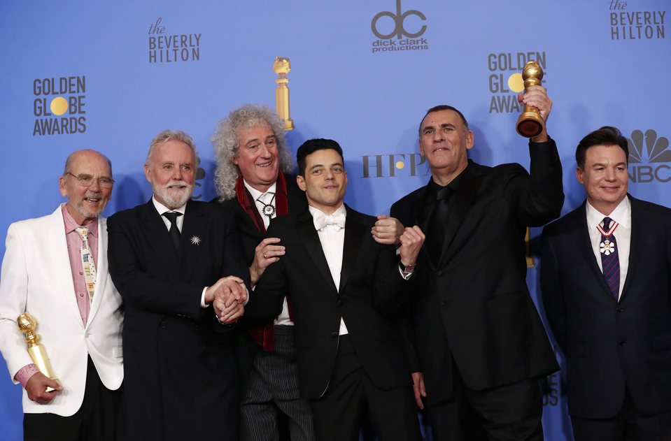 The cast of 'Bohemian Rhapsody' poses with its two Golnden Globes