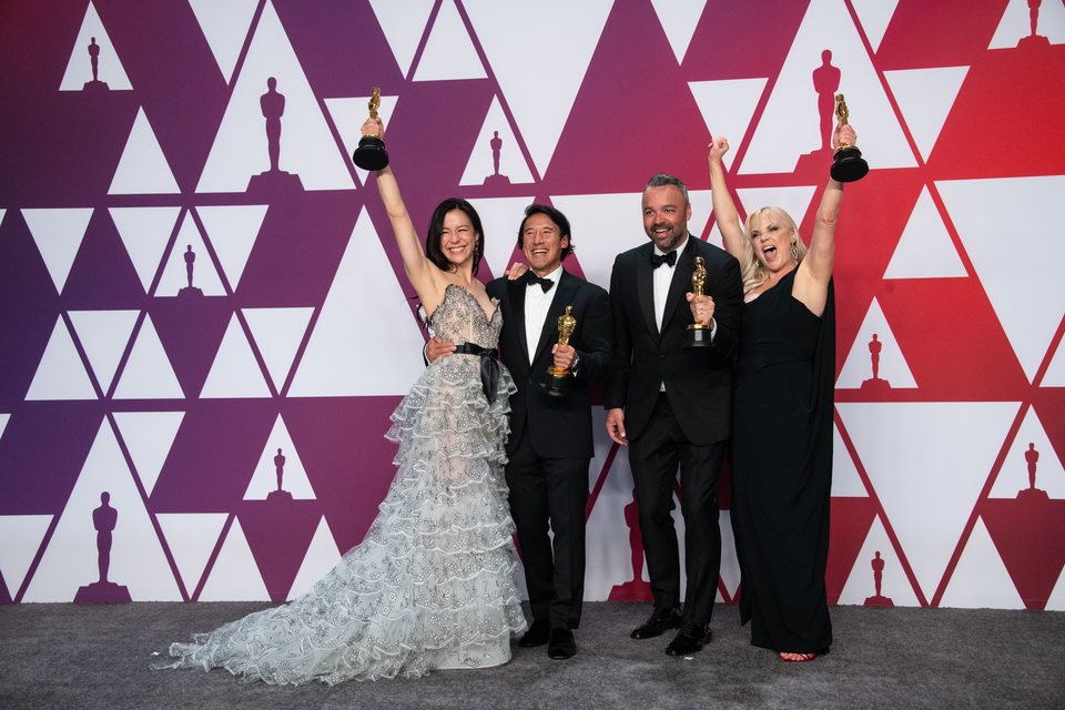 Oscars winners for Best Documentary Feature poses with their Oscars