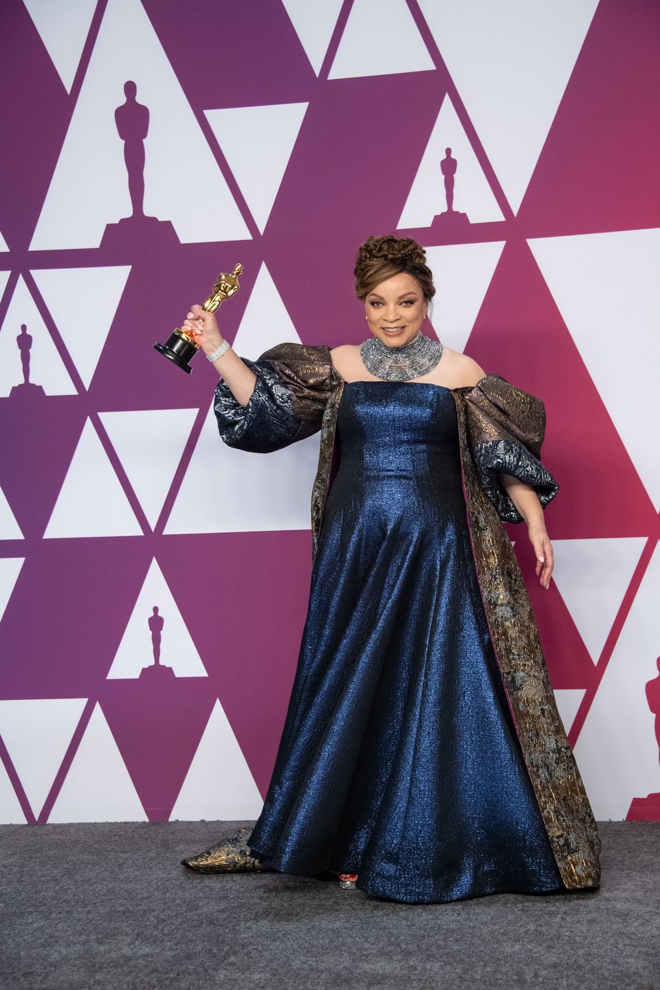 Oscar winner for Best Costume Design poses with her Oscar