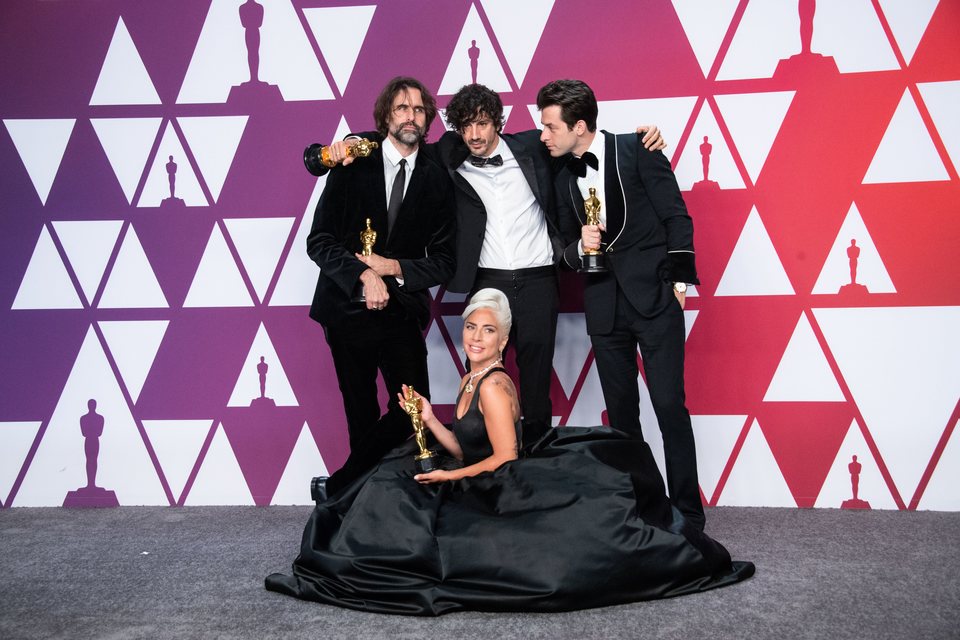 Oscar winners for Best Original Song for 'Shallow' pose with their Oscars