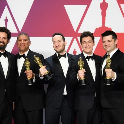 Oscar winners for Best Animated Feature Film for 'Spider-Man: Into the Spider-Verse' pose with their Oscars