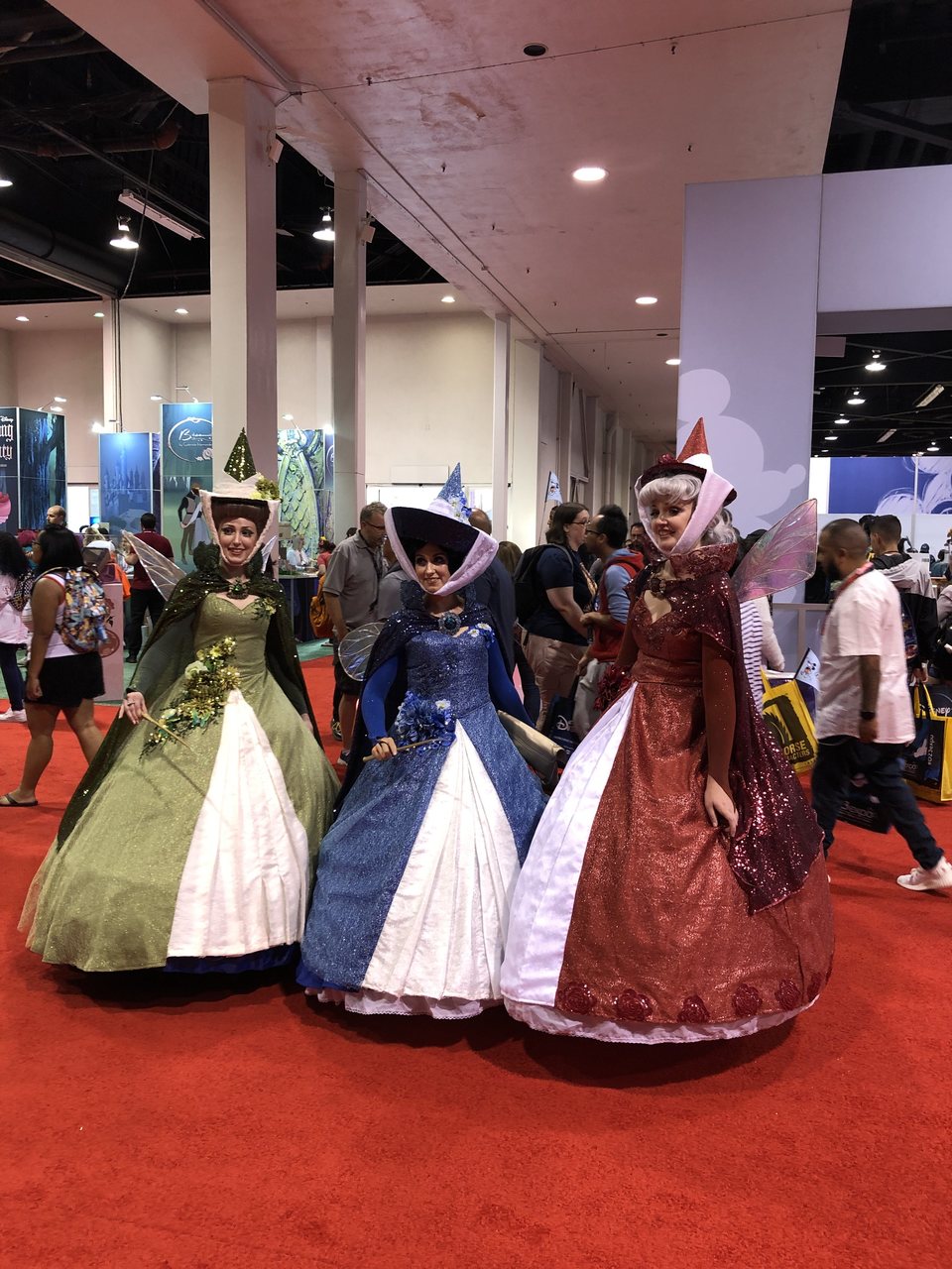 Three fans characterized as the fairies of 'Sleeping Beauty' on D23 2019