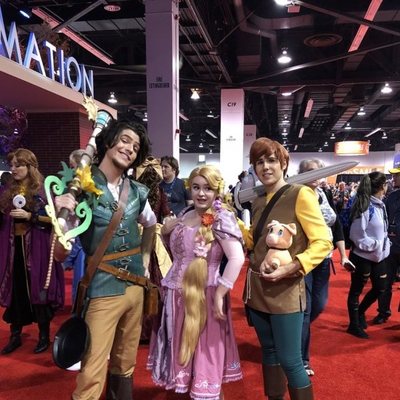 Fans dressed up as Flynn, Rapunzel and Taran, from 'Tangled' and 'The Black Cauldron'