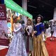 Fans dressed up as Cinderella, Aurora and Snow White