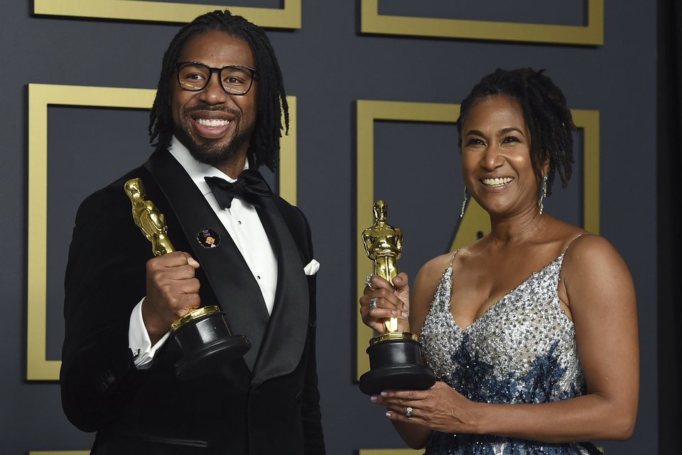 Matthew A. Cherry and Karen Rupert Toliver with their Oscar for Best Animated Short Film