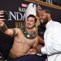 Ryan Coogler poses with a fan at the 'Black Panther: Wakanda Forever' premiere