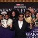 Tenoch Huerta Mejía poses with fans at the 'Black Panther: Wakanda Forever' premiere