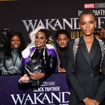 Letitia Wright poses with fans at the 'Black Panther: Wakanda Forever' premiere