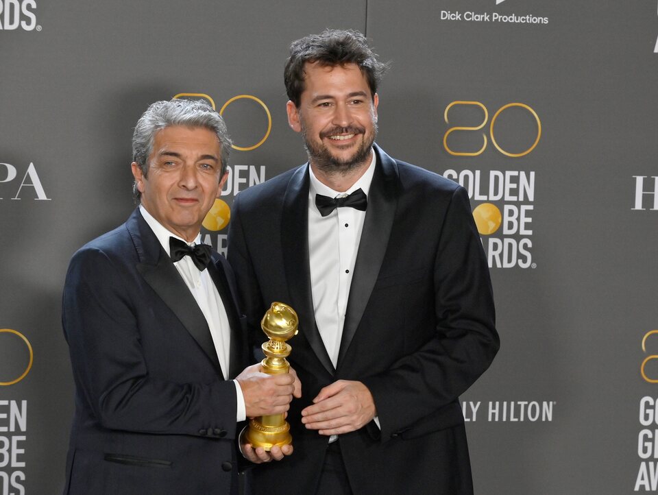 Ricardo Darín and Santiago Mitre pose as winners at the Golden Globes 2023