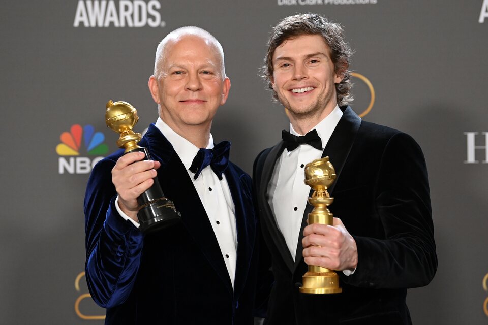 Ryan Murphy and Evan Peters pose with their Golden Globes 2023