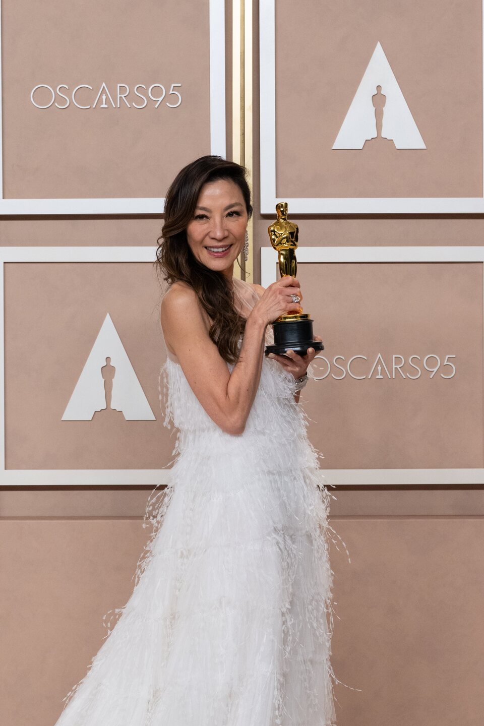 Michelle Yeoh with her Oscar for leading actress