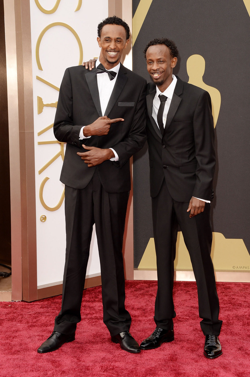 Faysal Ahmed y Barkhad Abdi at the 2014 Oscars