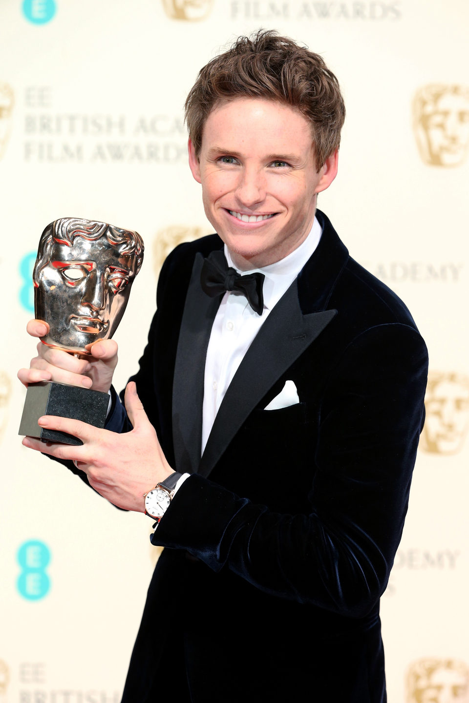 Eddie Redmayne posses with best actor award at the BAFTA 2015