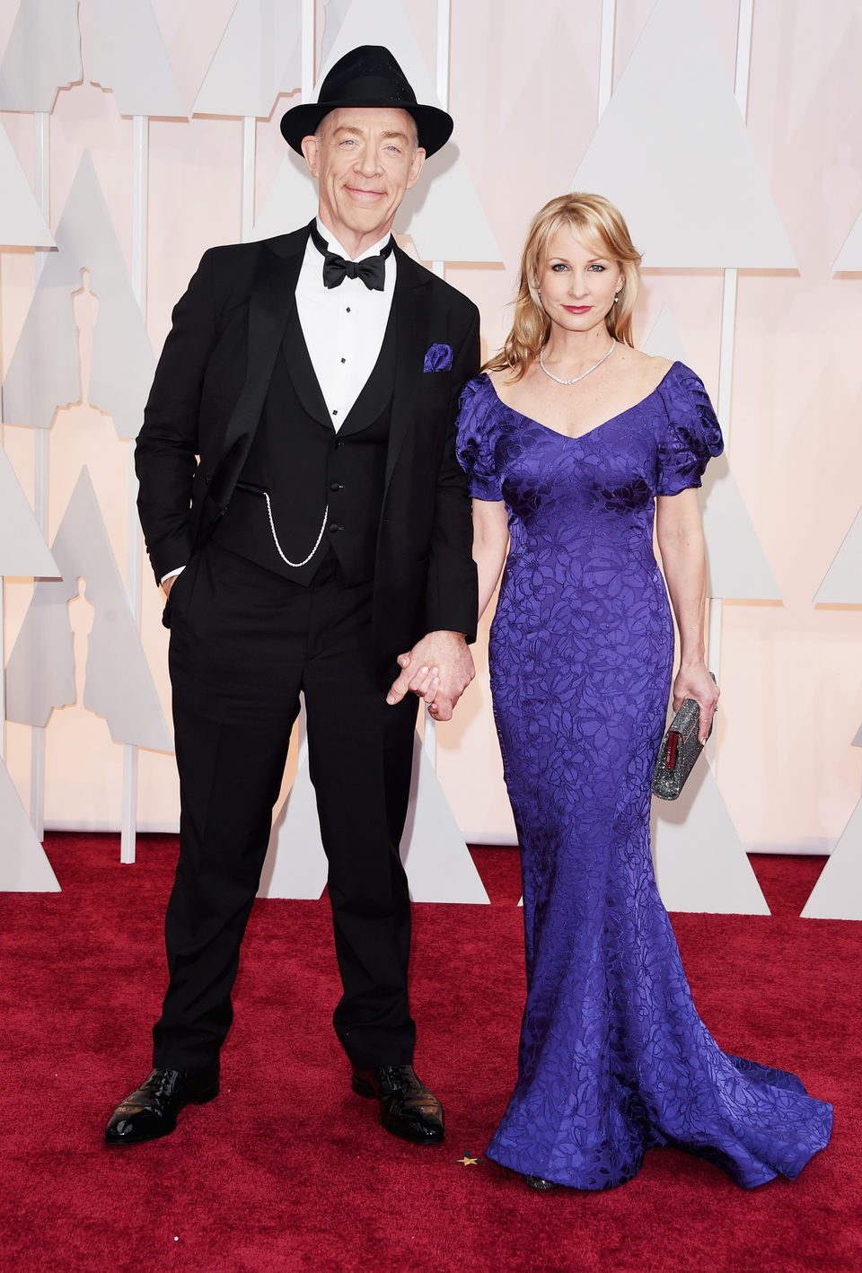 J.K. Simmons next to her wife Michelle Schumacher at the Oscars Awards 2015 red carpet