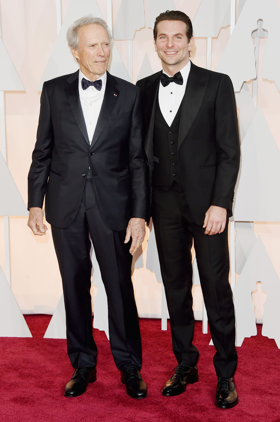 Bradley Cooper next to Clint Eastwood at the Oscars Awards 2015 red carpet