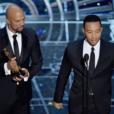 John Legend and Common receive the Best Song Oscar Award