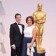 Graham Moore and his mother poss in the Oscar 2015 red carpet