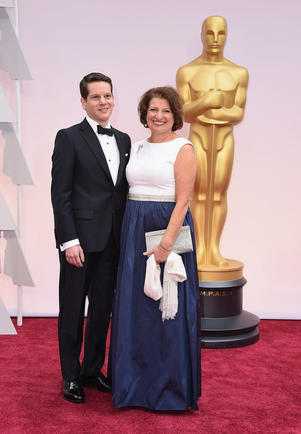 Graham Moore and his mother poss in the Oscar 2015 red carpet