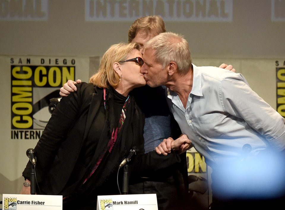 Carrie Fisher and Harrison Ford kiss at the 'Star Wars: The Force Awakens' panel at Comic-Con 2015