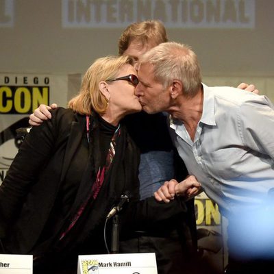 Carrie Fisher and Harrison Ford kiss at the 'Star Wars: The Force Awakens' panel at Comic-Con 2015