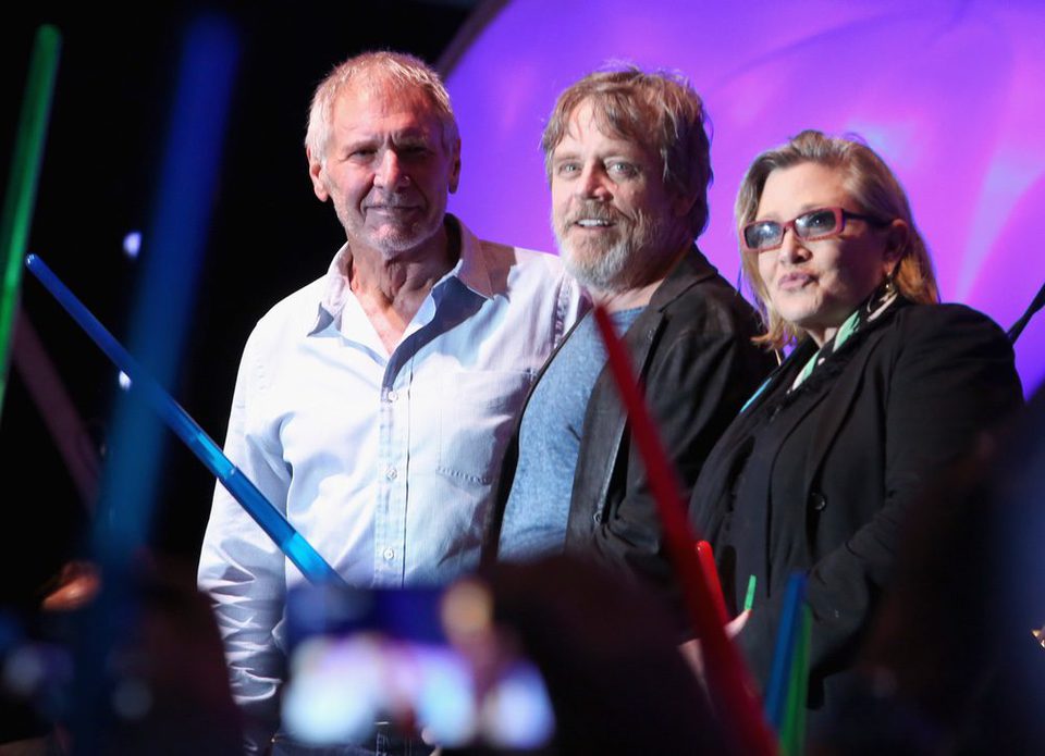 Harrison Ford , Mark Hamill and Carrie Fisher with lightsabers at Comic -Con 2015