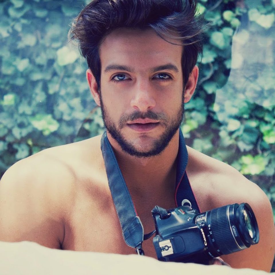 Naked Joaquín Ferreira with a camera