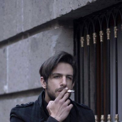 Joaquín Ferreira smoking on the street