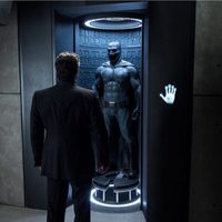 Bruce Wayne admires his suit for the first time