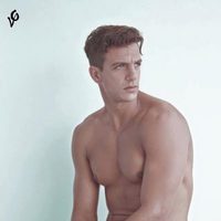 Joaquín Ferreira poses naked on a chair