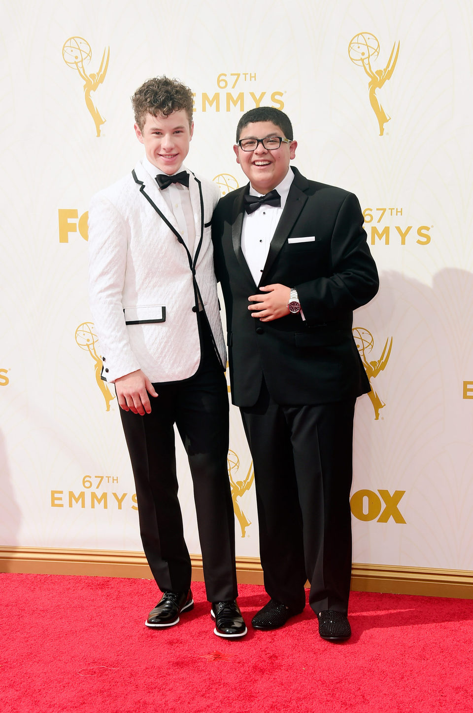 Rico Rodriguez and Nolan Gould at the red carpet of the Emmys 2015