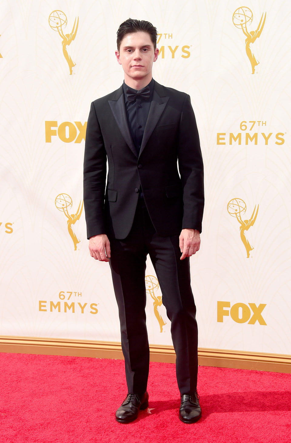 Evan Peters at the red carpet of the 2015 Emmys