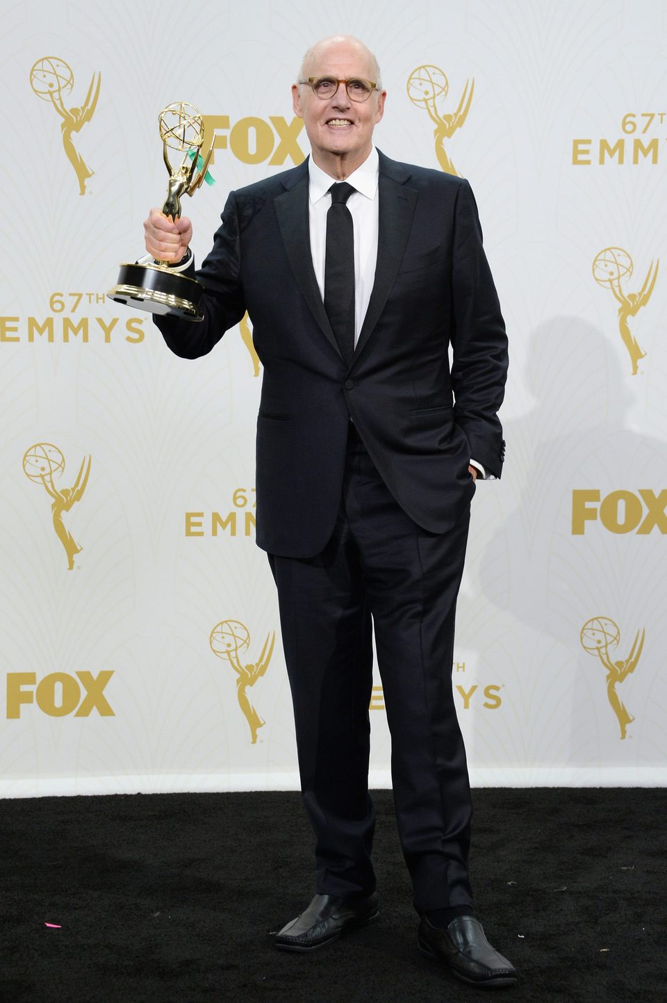 Jeffrey Tambor posing with his 2015 Emmy Award