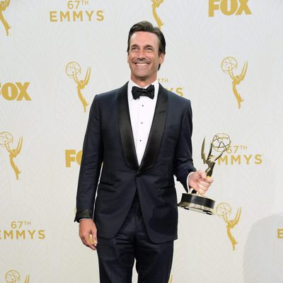 Jon Hamm posing with his 2015 Emmy Award