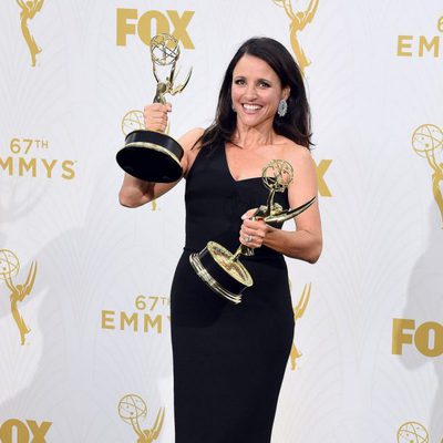 Julia Louis-Dreyfus posing with her two 2015 Emmy Awards