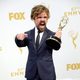 Peter Dinklage posing with his 2015 Emmy Award