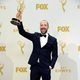 Tony Hale posing with his 2015 Emmy Award