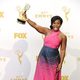 Uzo Aduba posing with her 2015 Emmy Award