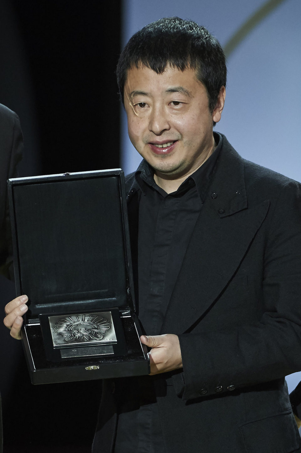 Director Jia Zhang-ke receives the Audience Award for his film 'Mountains May Depart' during the closing ceremony of the 63rd San Sebastian International F