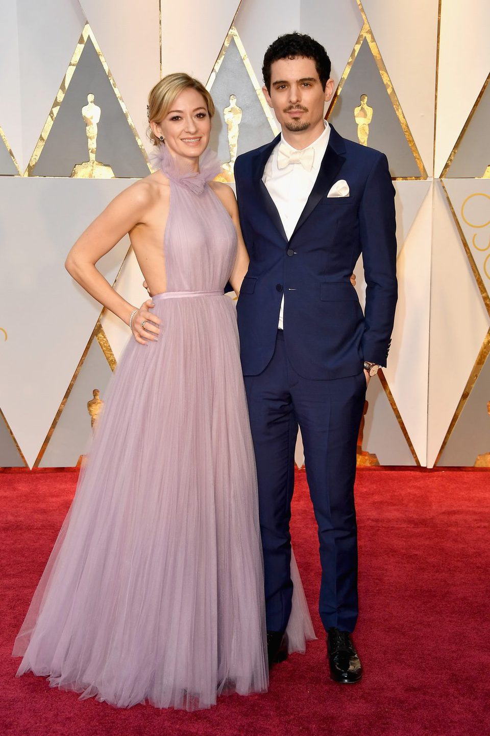 Damien Chazelle and Olivia Hamilton at the red carpet of the Oscars 2017