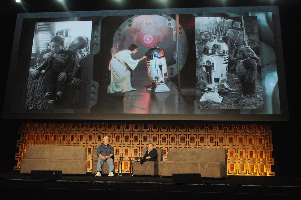 Warwick Davis and George Lucas in the Star Wars Celebration