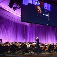 John Williams leading the orchestra in the Star Wars Celebration